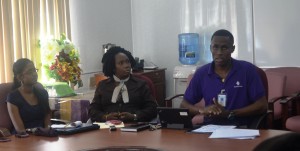 Deputy Permanent Secretary Ms Joylyn Burrows -Administrative (centre) with Republic Bank rep. (right) and M and E Unit staff during the workshop