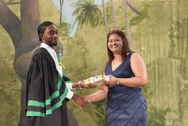 Top student, Andy Bansgopaul receiving one of his many prizes