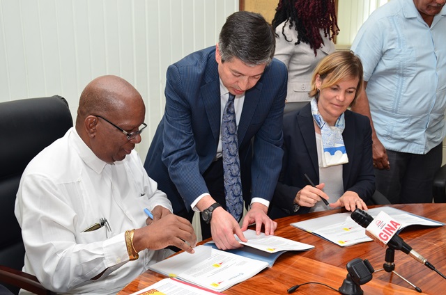 Minister of Finance ,Winston Jordan and Sophie Sirtaine, World Bank Country Director, Caribbean Country Management Unit Latin America and the Caribbean Region sign the US$3M agreement for the rehabilitation of the Cunha Canal