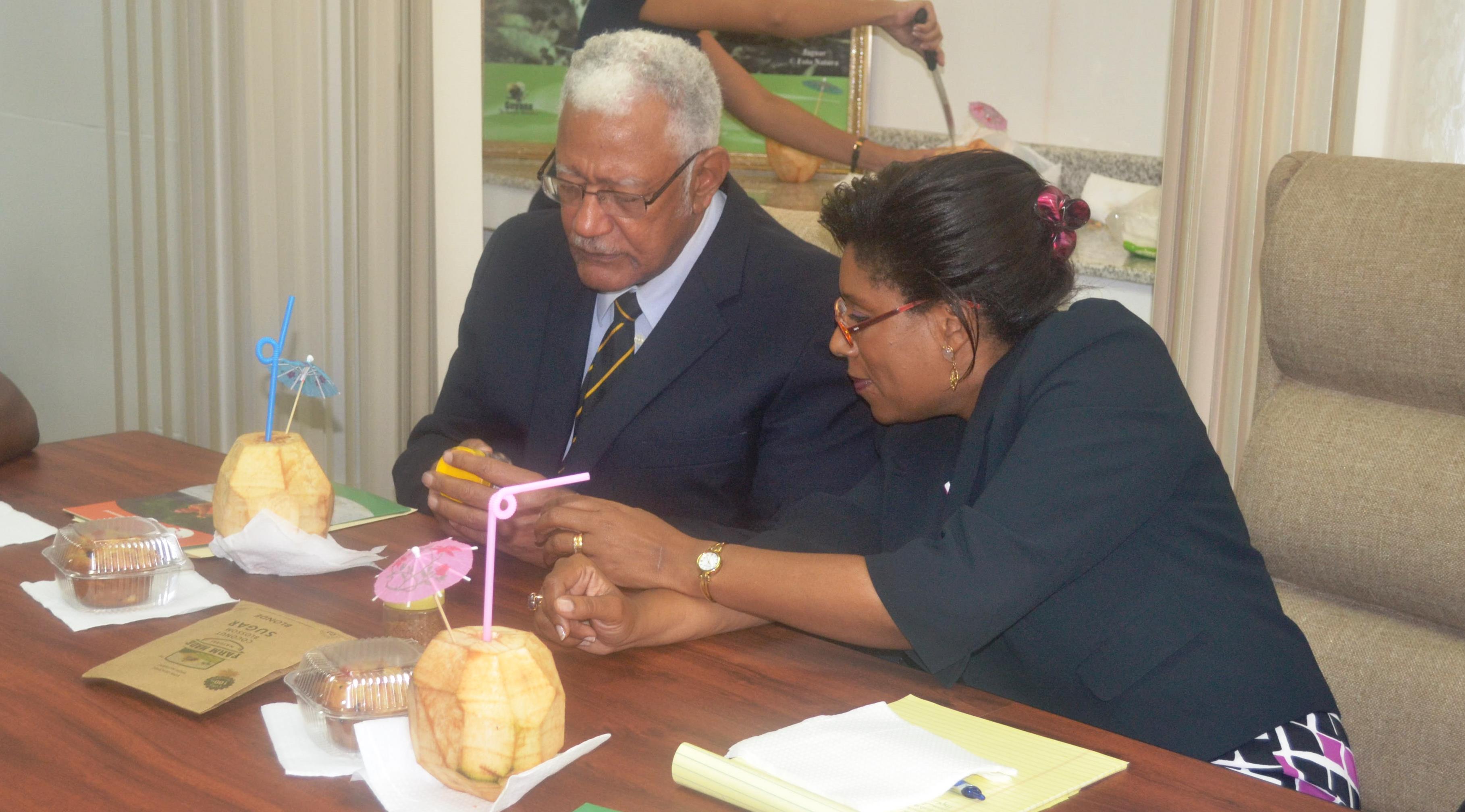 Ministers of Agriculture and Tourism examin some coconut biproducts during the Coconut Festival presentation briefing
