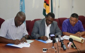 ps-of-the-ministry-of-agriculture-mr-george-jervis-and-fao-country-rep-mr-rubeen-robertson-accompanied-by-the-cfo-mr-denzil-roberts-while-signing-the-psma