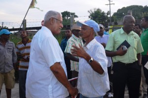 minister-holder-engaging-a-farmer-after-the-meeting