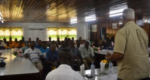Agriculture Minister, Noel Holder addressing rice farmers during farmers' meeting