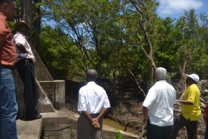 Minister Holder and other officials at the Trafalgar Sluice