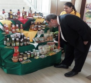 Prime Minister of St. Vincent and the Grenadines having a closer look at some of the products on display