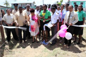 Minister Amna Ally, commissions one of the shade houses built from the practical agriculture curriculum at the Lower Corentyne Secondary School.