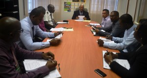 Minister Holder and other officials during the meeting