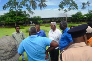 Minister Holder and other officials while visiting Arjoon's poultry farm