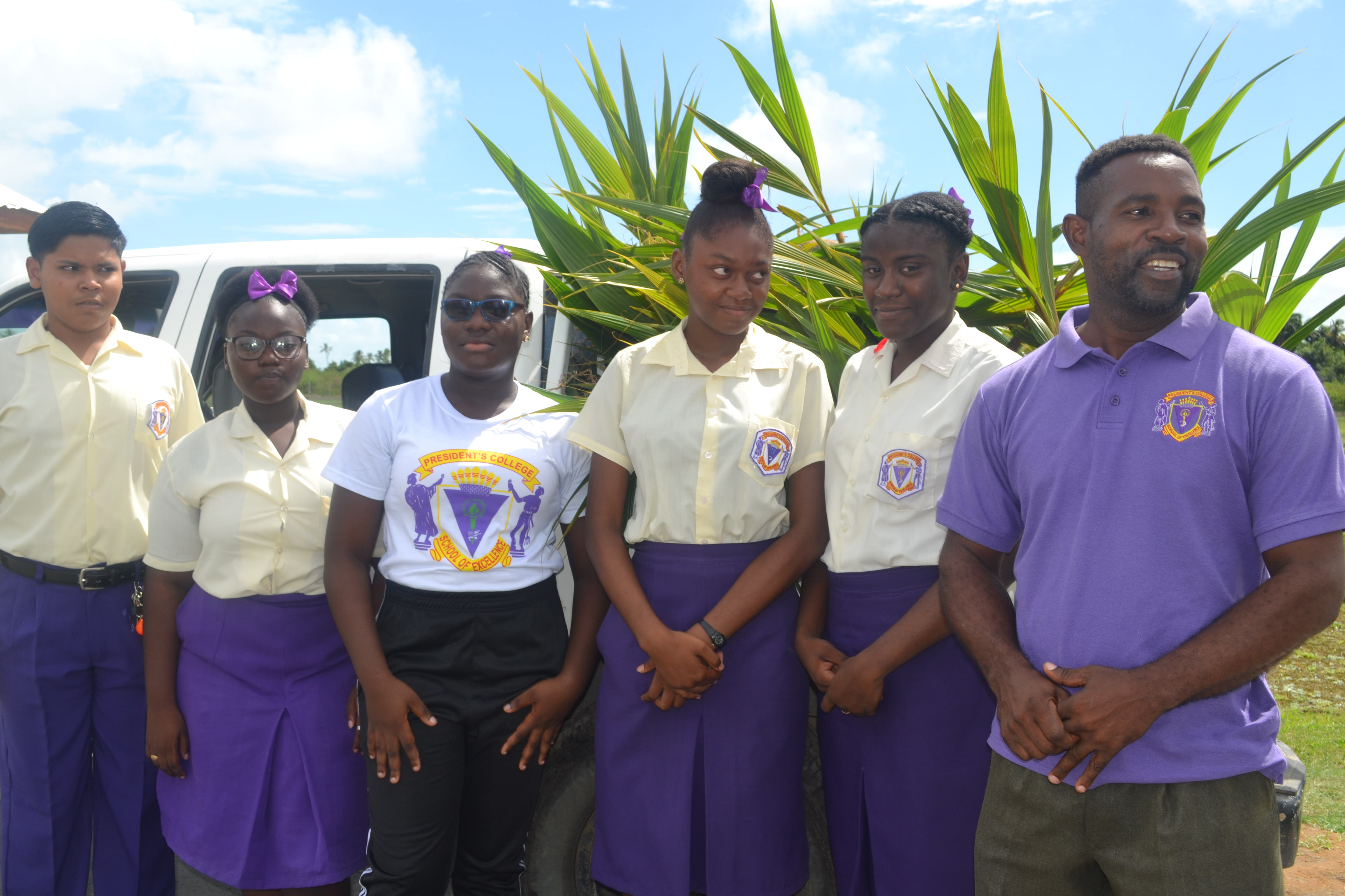 Head of the Agriculture Science Department at President's College, Mr. Cranston Richmond with some of the school's agriculture science students