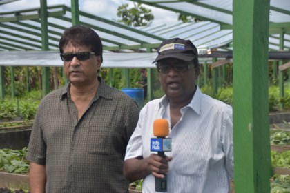 Dr. Homenauth along with farm owner Rameesh Ramraptan.