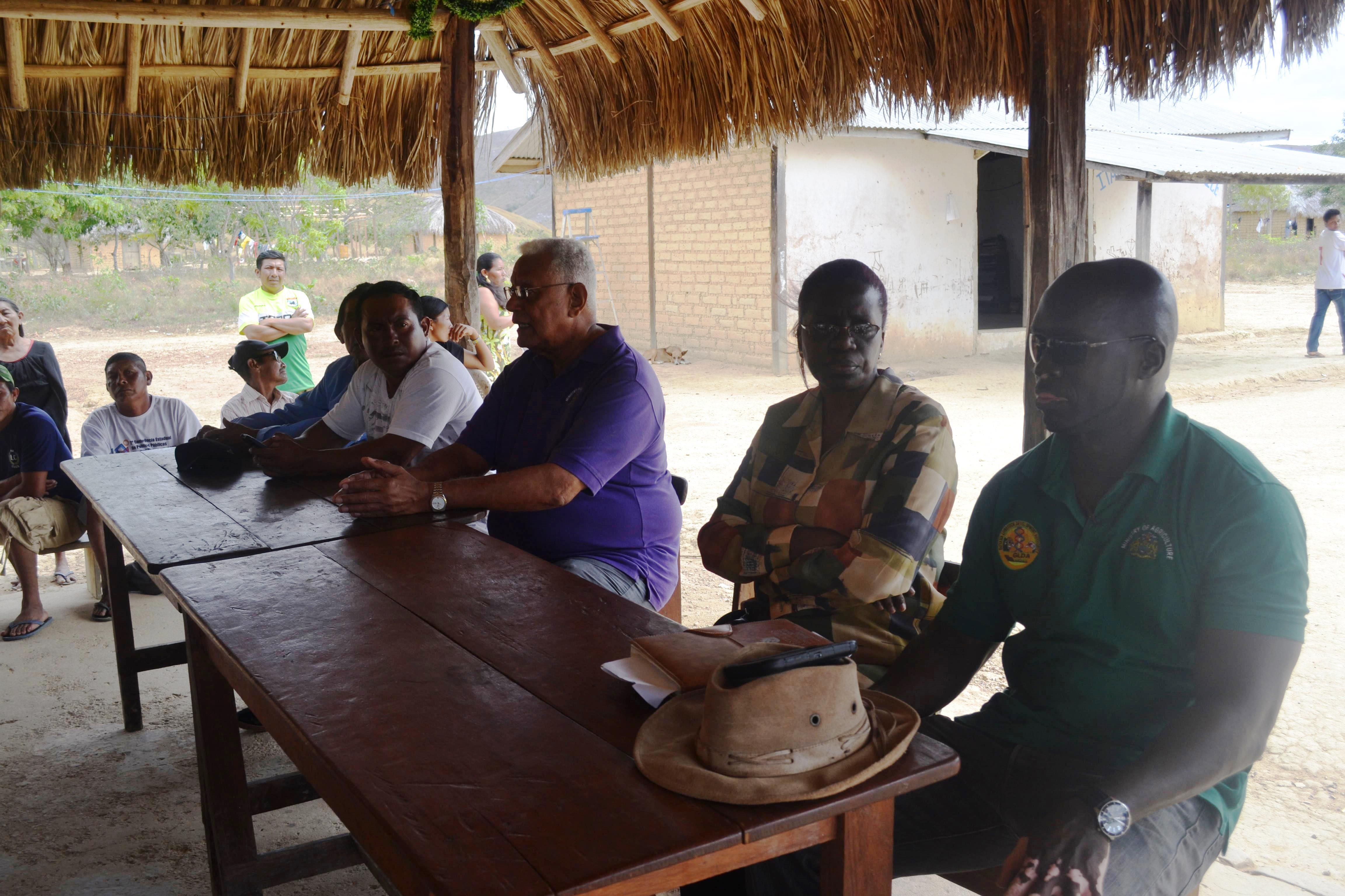 Minister Holder and other officials during a meeting with the residents of Itabac, Region 8