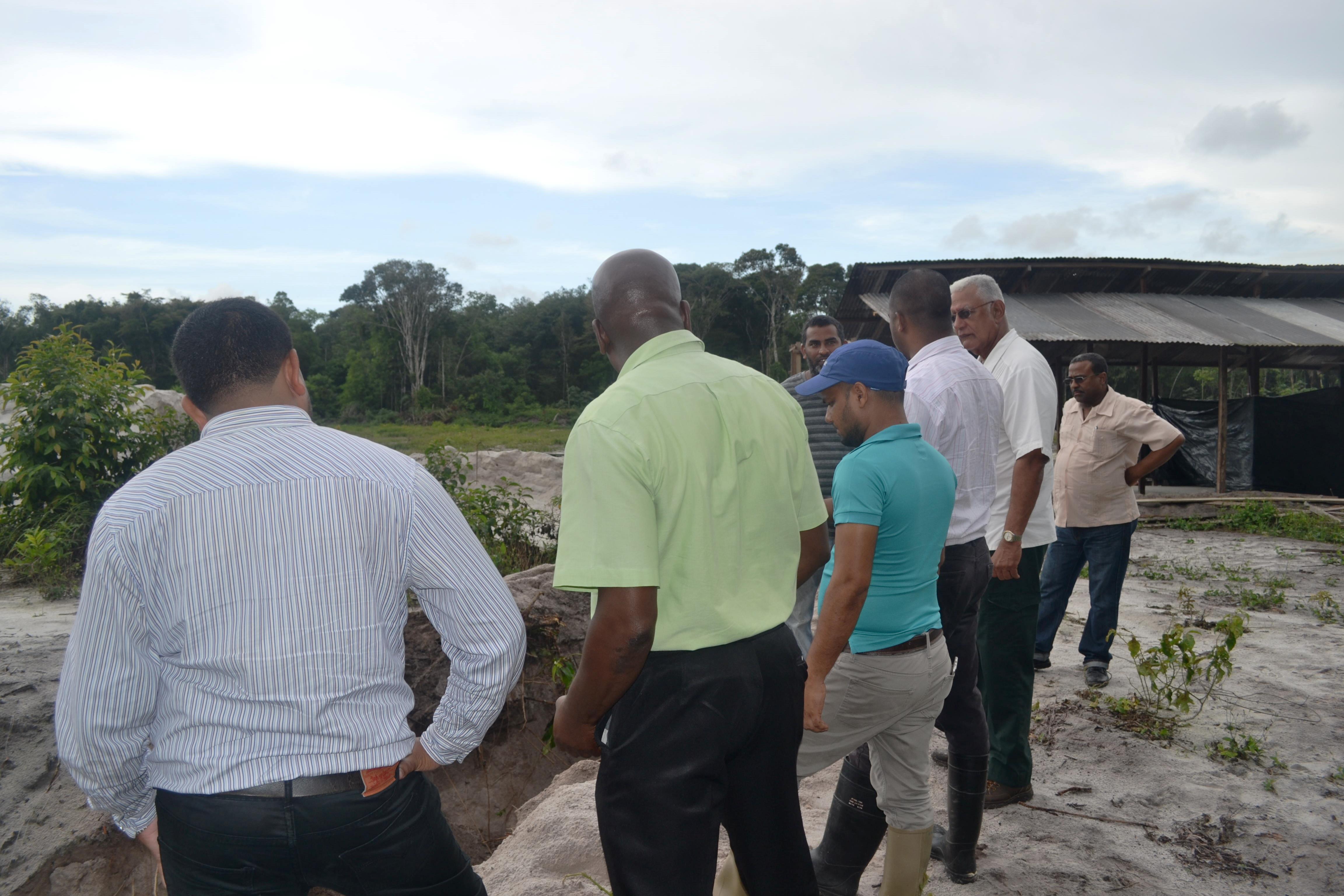 Minister Holder and other officials during the visit to farms in the Laluni area
