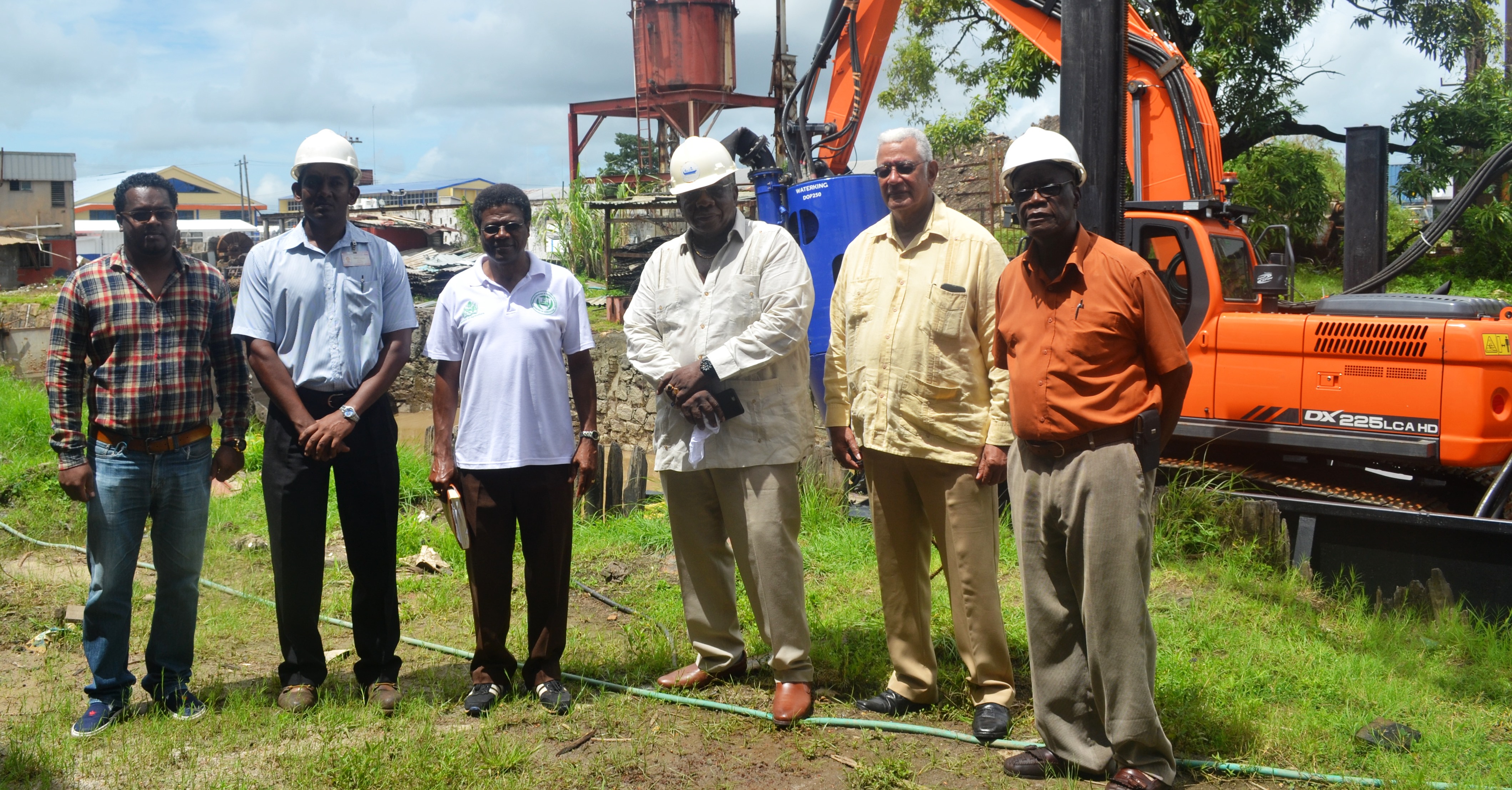 From left-NDIA Engineer, Kenny Seurattan, GNIC Shipyard Nanager, Jagdesh Ranjag, NDIA CEO, Fredrick Flatts, GNIC CEO, Clinton Williams, Agri. Minister Noel Holder and GNIC Shipyard Consultant, Ronald Bourne