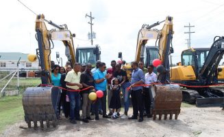 Agri. Minister hands over four mini excavators to NDCs in Reg. 5